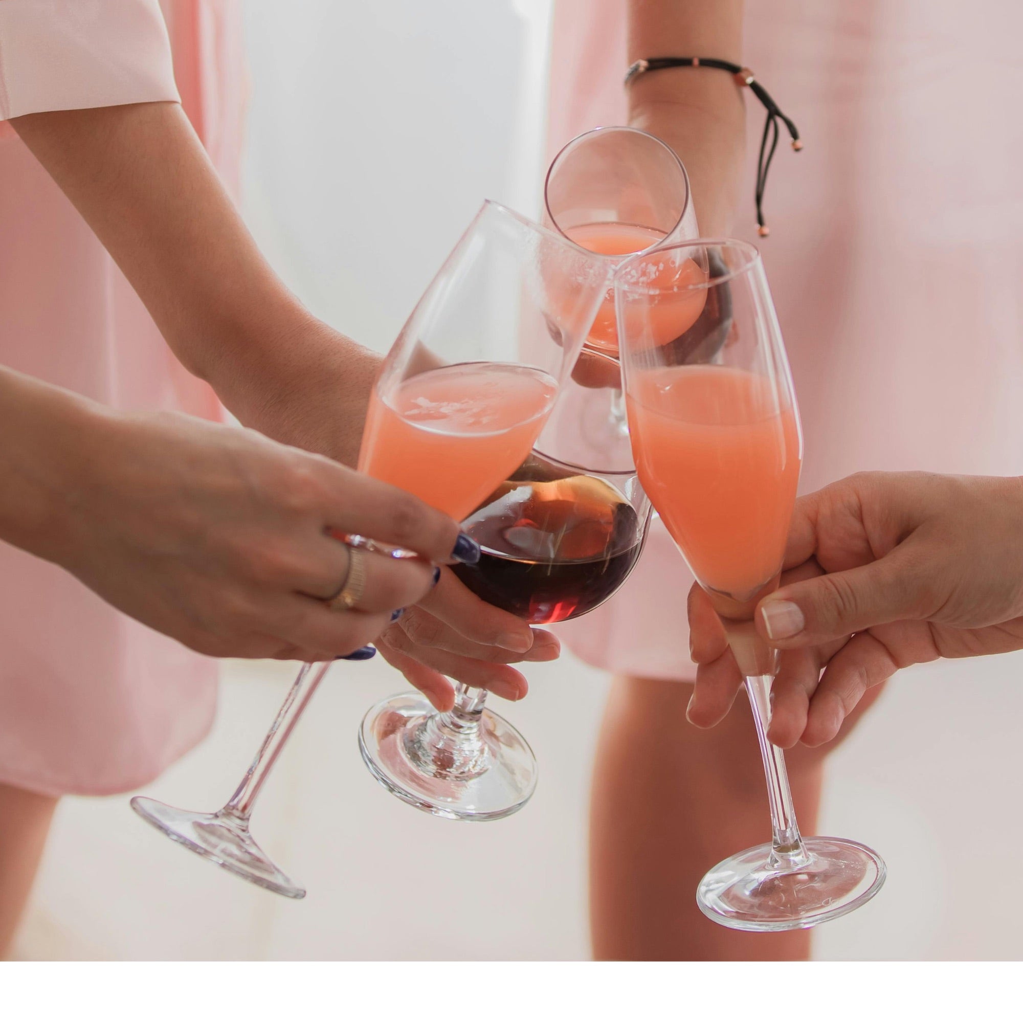 Guests toasting with champagne at a private charm party at Club Coastal Charleston