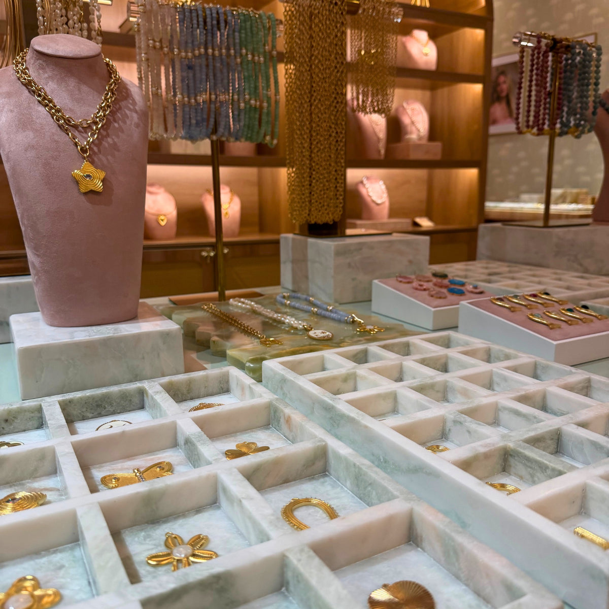 Gold pendant necklaces on display at the Club Coastal Charleston Pendant Bar